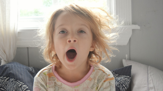 child yawning due to sleep difficulties