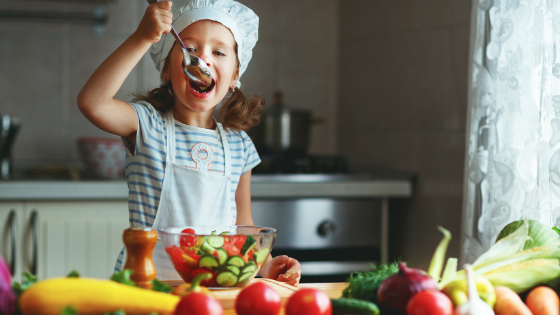 child making food based on intuitive eating principle of mindful eating