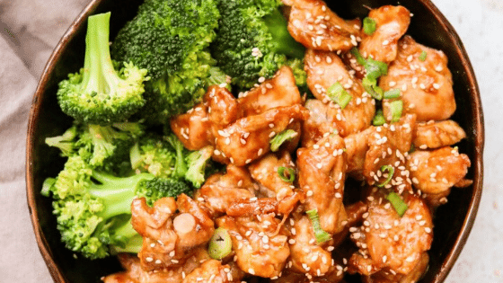 air fryer sesame chicken with broccoli in a bowl