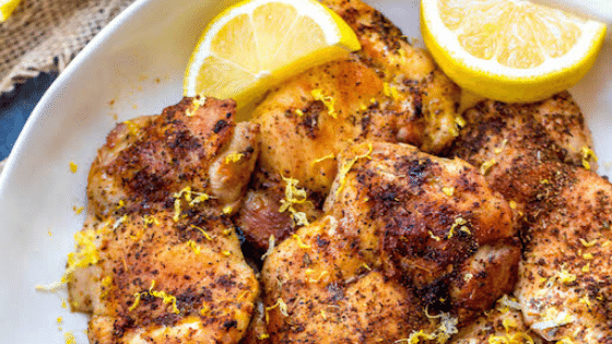 lemon chicken on plate with lemons