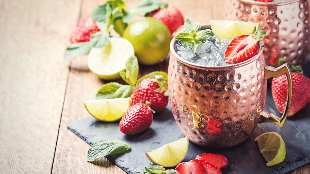 strawberry moscow mule in a copper mug, a perfect summer drink recipe