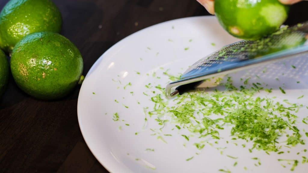zesting limes for key lime cookies